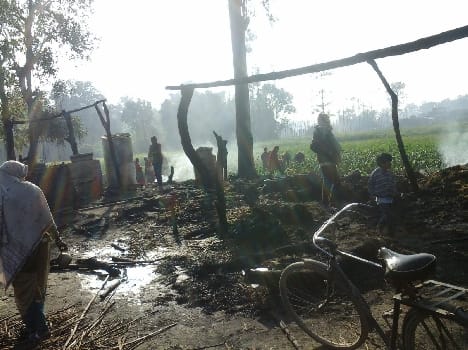 Four charred house , two people Scorched