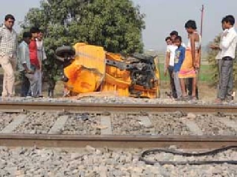 Auto collides with freight train , driver 