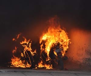 fire on bike, clash in two group