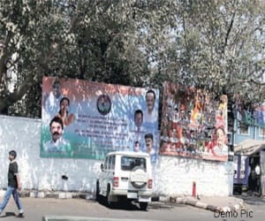 Posters on public buildings, will take action on putting ads.