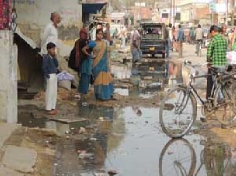 Shops , houses and temples in the dirty water flowing