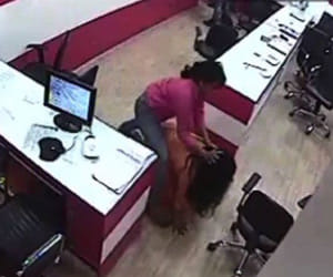 watch video where lady bouncer beating wife of his owner in office at delhi
