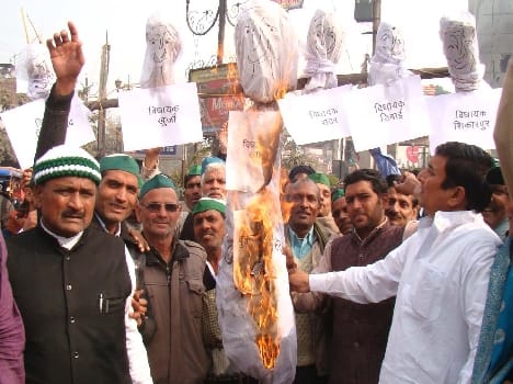 Farmers burned effigies of six legislators