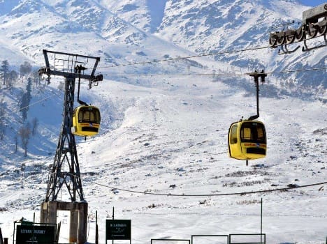 Tourists wait for snow