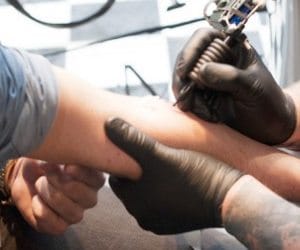 youngster having religious tatto on hand can join army