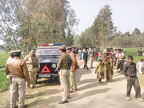 The young man 's body was found in a field , killing suspected