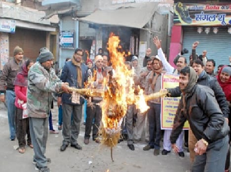 Burnt effigies of Education Minister