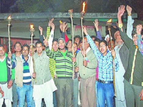 torch march in protest of GST bill