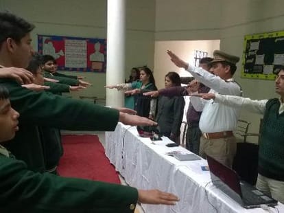 Children take oath to follow rules of the road.