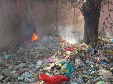 AYUSH wing people burning garbage behind upset