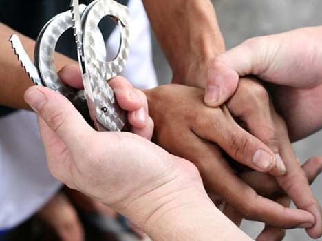 two students arrested accused of beating former national shooter