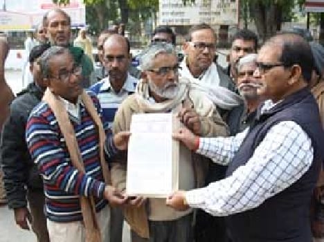Teachers submit a memorandum to senior officials in the Collectorate premises