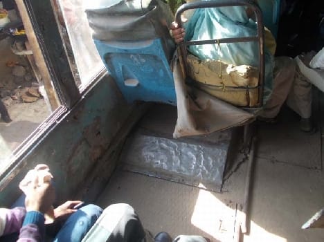 Decaying roadways bus, passenger upset