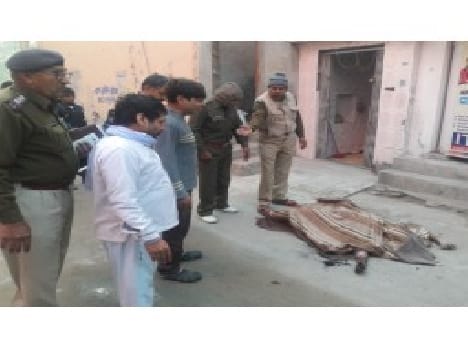 Half-burnt body of a young woman in front of the police station was