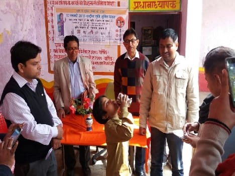 Children carrying destroyer worm medicine to eradicate insects feed