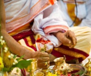 con lotted the priest by giving an offer.