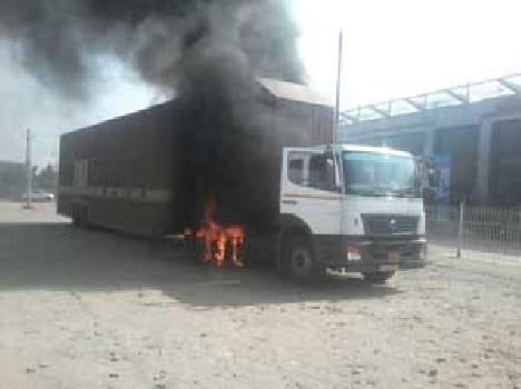 Standing in front of the showroom trailer fire