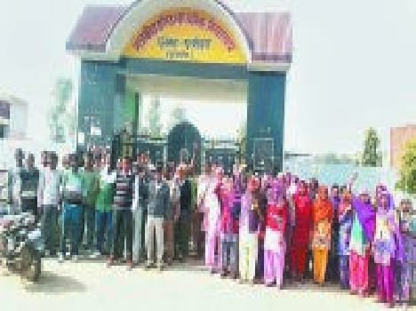 angery villagers lock school gate