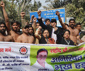 Youth Brigade against the corporation and perform topless.