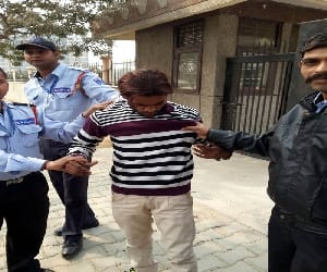 Security guards snatched the bag and caught the crooks running.