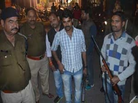 Two arrested with gun