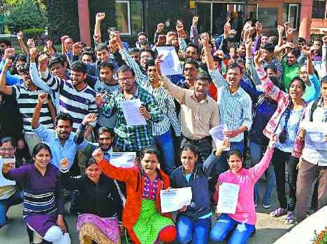 students protest during cbi raid in niper mohali office