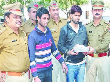 Two robbers arrested, one at large