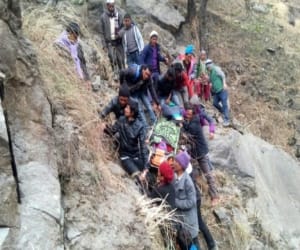 villager bring injured woman in stature.