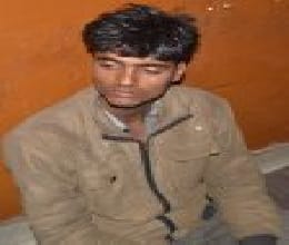 A young man caught stealing clothes in shop