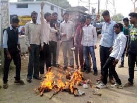 Burned effigies of mining surveyor