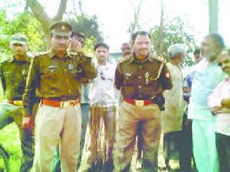The bodies of the murdered young man hanging from tree