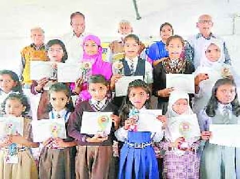 Faces of children bloom receiving honors 