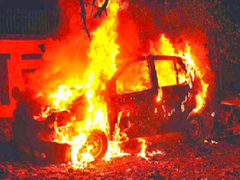 By flames charred car was splashed