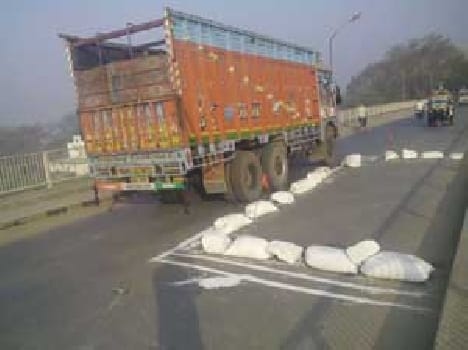 Hameed overloaded trucks passing through the bridge after the ban